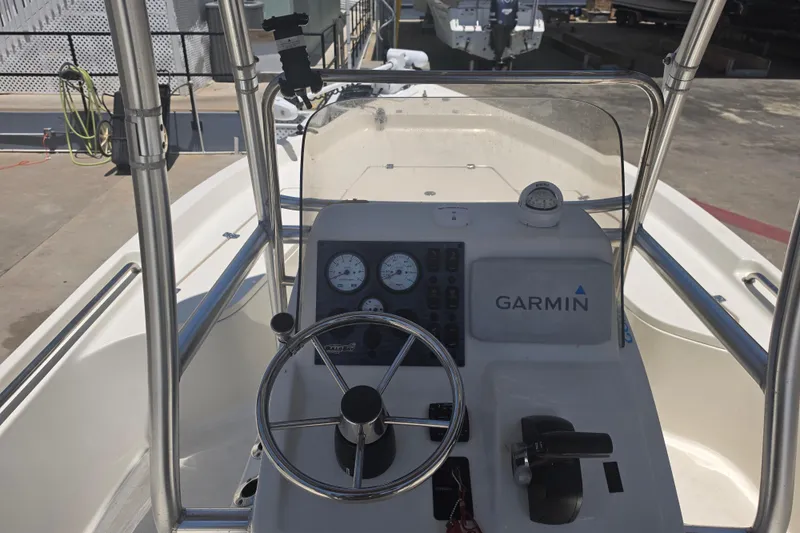Slide: The Image of 2021 Bulls Bay 2200 boat dashboard with Garmin navigation system and steering wheel. - 30