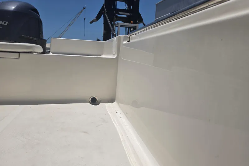 Slide: The Image of 2021 Bulls Bay 2200 boat interior with visible engine and deck details. - 73