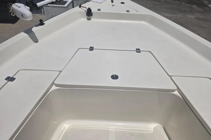 Slide: The Image of 2021 Bulls Bay 2200 boat deck with storage compartments and trolling motor. - 54