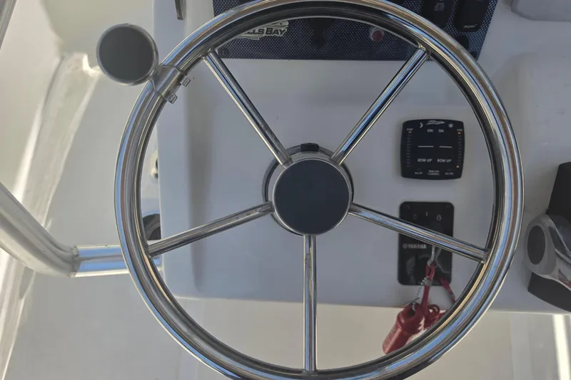 Slide: The Image of Steering wheel of a 2021 Bulls Bay 2200 boat, showcasing control panel details. - 45