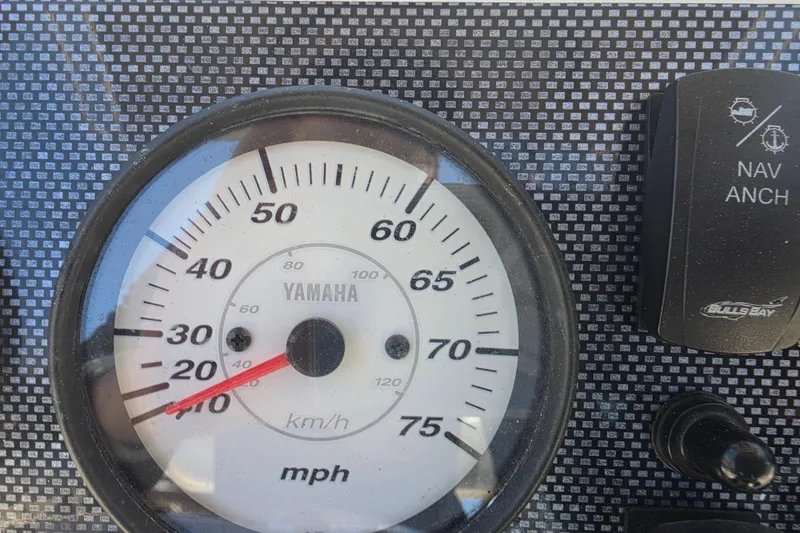Slide: The Image of Close-up of a Yamaha speedometer on a 2021 Bulls Bay 2200 boat dashboard. - 37