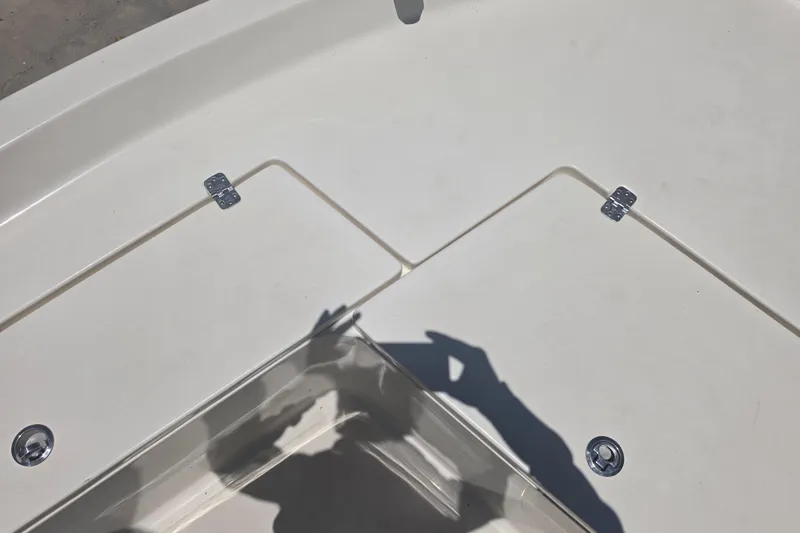 Slide: The Image of 2021 Bulls Bay 2200 boat deck with storage compartments and shadow. - 60