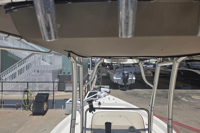 Slide: The Image of 2021 Bulls Bay 2200 boat docked at a marina with other vessels. - 24