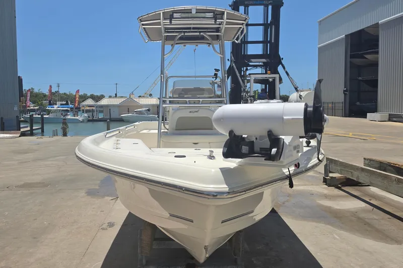 Slide: The Image of 2021 Bulls Bay 2200 boat docked at a marina under clear blue skies. - 18