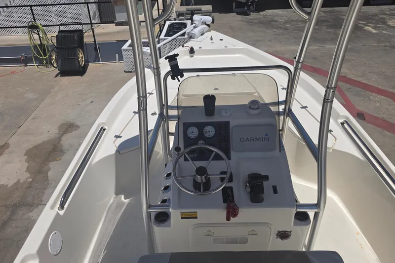 Slide: The Image of 2021 Bulls Bay 2200 boat interior with steering console and Garmin equipment. - 25
