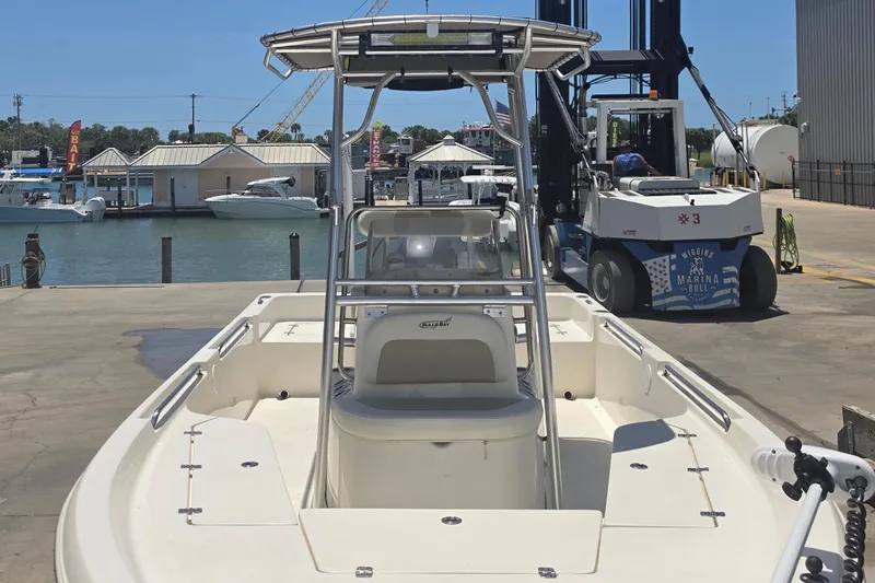 Slide: The Image of 2021 Bulls Bay 2200 boat at marina dock with forklift and water view. - 17