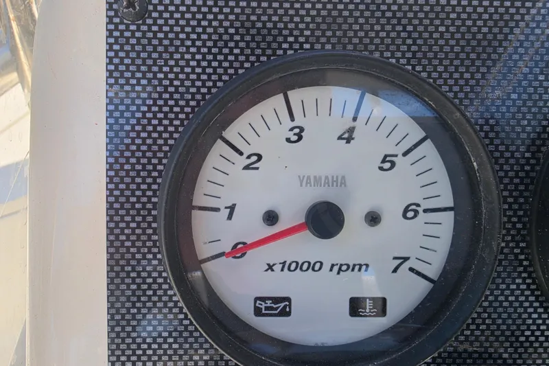 Slide: The Image of Yamaha tachometer on 2021 Bulls Bay 2200 boat dashboard, displaying RPM gauge. - 36