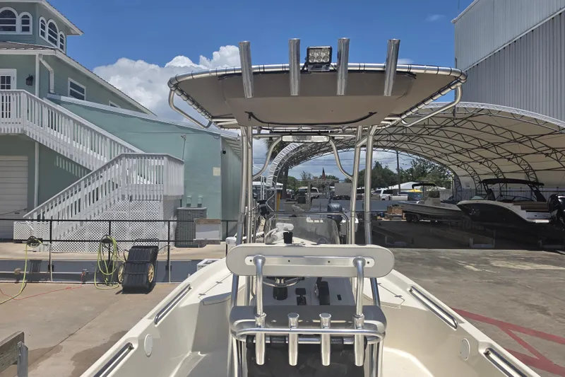 Slide: The Image of 2021 Bulls Bay 2200 boat docked at marina with canopy and clear sky. - 23