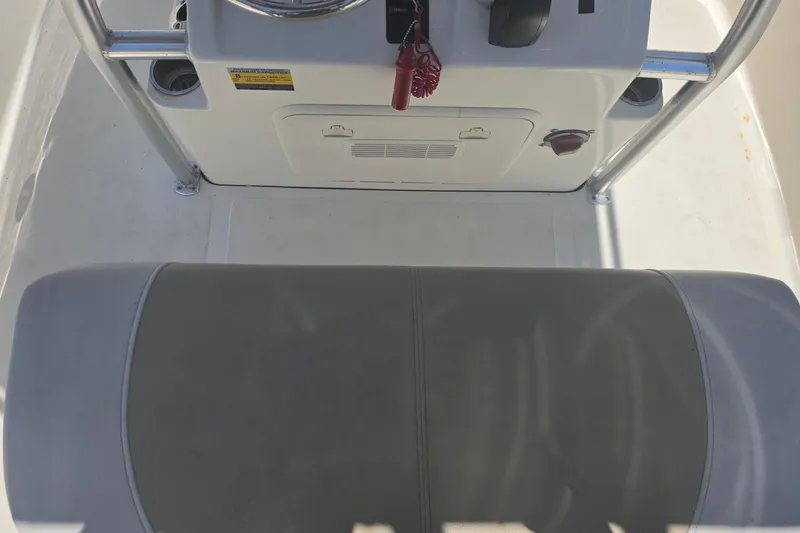 Slide: The Image of Interior view of a 2021 Bulls Bay 2200 boat console and seating area. - 46