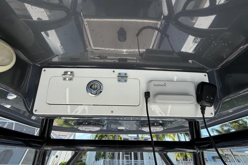 Slide: The Image of 2023 Sportsman Heritage 241 Center Console boat dashboard with Garmin equipment. - 22