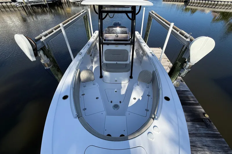Slide: The Image of 2023 Sportsman Heritage 241 Center Console boat docked at marina. - 41