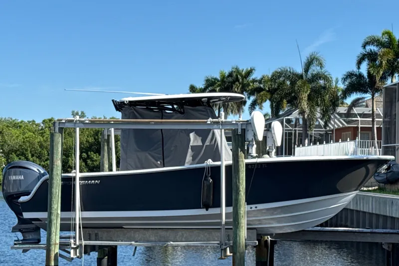 The Image of 2023 Sportsman Heritage 241 Center Console boat docked with Yamaha engine. - 0