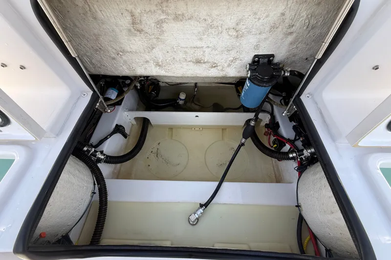 Slide: The Image of 2023 Sportsman Heritage 241 Center Console engine compartment, showcasing internal components and wiring. - 58
