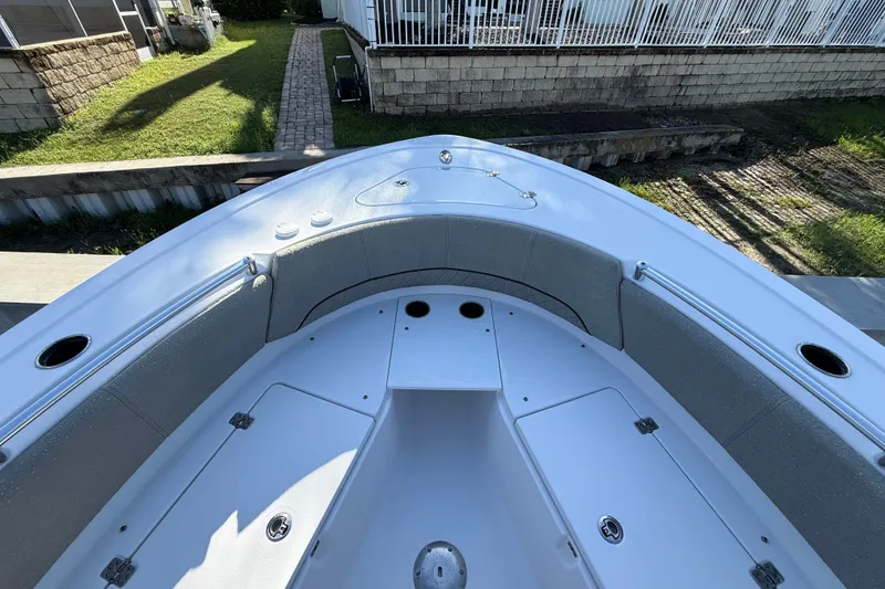 Slide: The Image of 2023 Sportsman Heritage 241 Center Console boat interior with seating and storage compartments. - 36