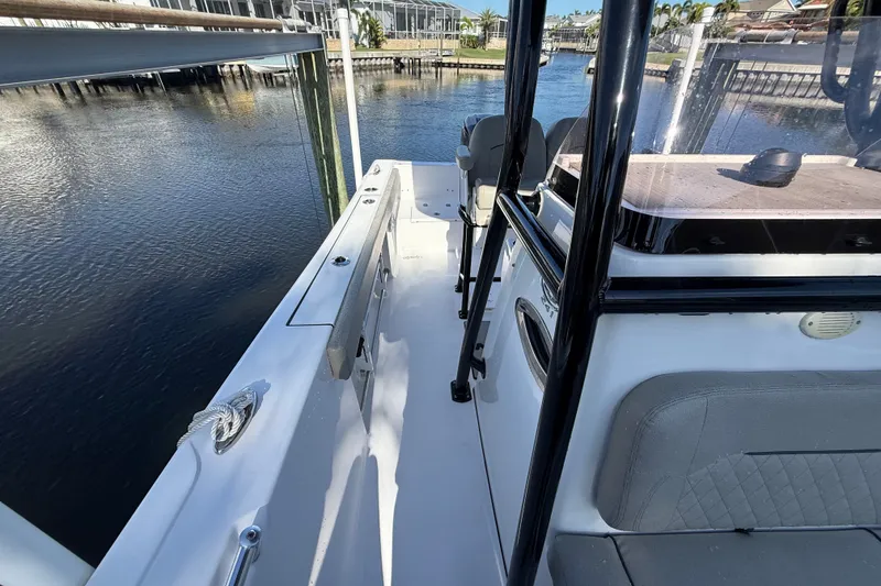 Slide: The Image of 2023 Sportsman Heritage 241 Center Console boat docked by the water. - 50