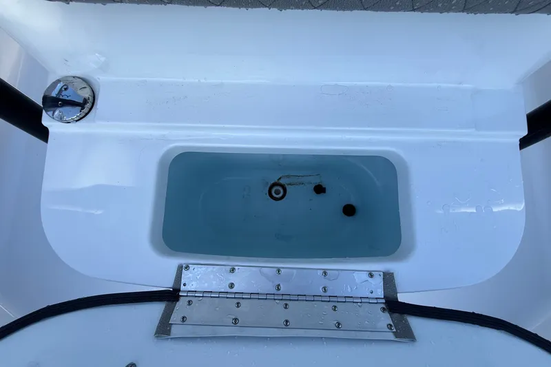 Slide: The Image of Livewell on 2023 Sportsman Heritage 241 Center Console boat, featuring clean design and functionality. - 48