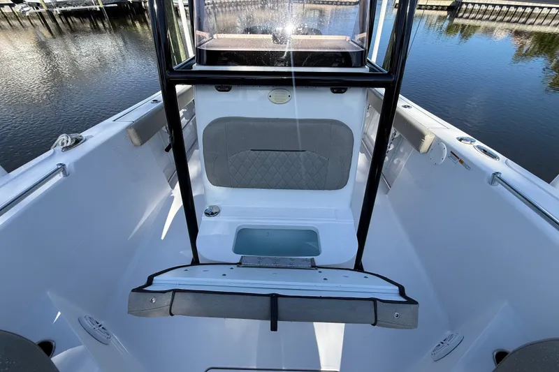Slide: The Image of 2023 Sportsman Heritage 241 Center Console boat interior with seating and storage. - 47