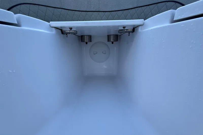 Slide: The Image of Interior view of 2023 Sportsman Heritage 241 Center Console storage compartment. - 35