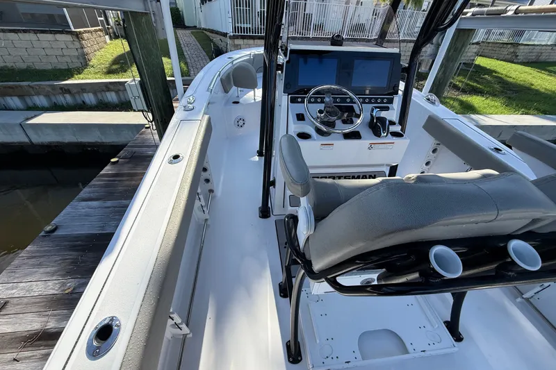 Slide: The Image of 2023 Sportsman Heritage 241 Center Console boat interior with helm and seating. - 24