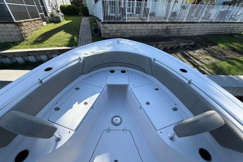 Slide: The Image of 2023 Sportsman Heritage 241 Center Console boat with spacious seating and storage compartments. - 30