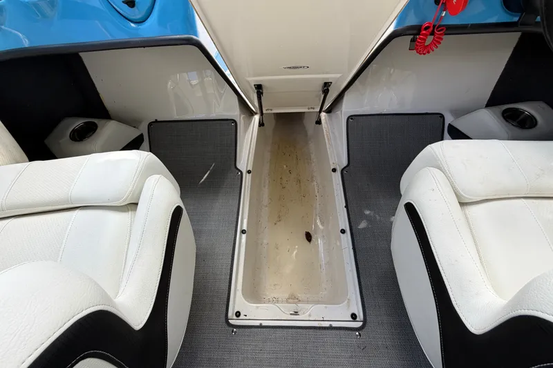 Slide: The Image of Interior of a 2021 Campion Allante 180 boat, featuring white seating and storage compartment. - 39