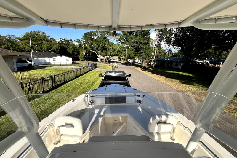 Slide: The Image of 2021 Cobia 240 Center Console boat on trailer in residential neighborhood. - 61