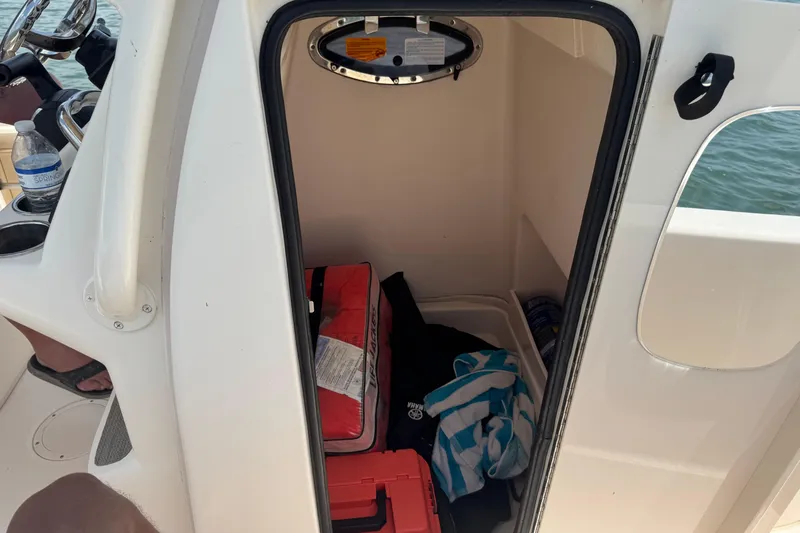 Slide: The Image of Storage compartment inside a 2021 Grady-White 251 Coastal Explorer boat. - 66