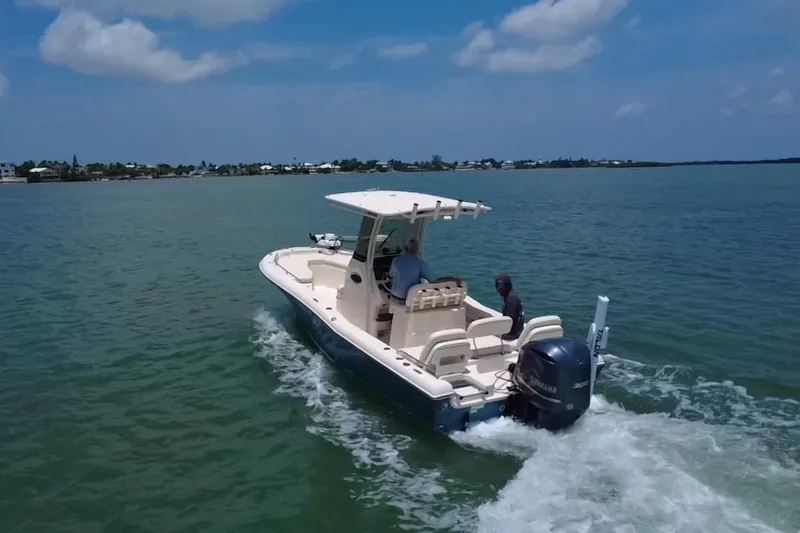 Slide: The Image of 2021 Grady-White 251 Coastal Explorer boat cruising on a sunny day. - 36