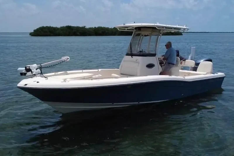 Slide: The Image of 2021 Grady-White 251 Coastal Explorer boat on calm water, featuring sleek design. - 32