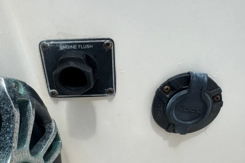 Slide: The Image of 2021 Grady-White 251 Coastal Explorer engine flush and NOCO port detail. - 50
