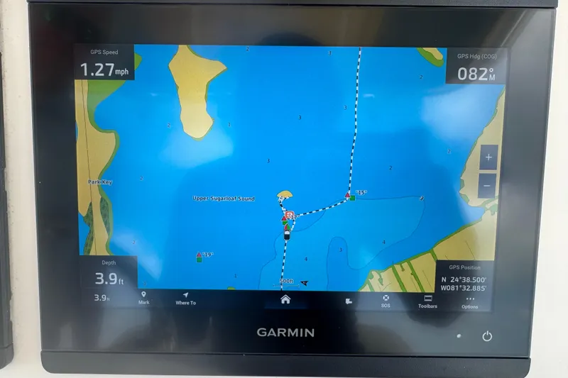 Slide: The Image of Garmin GPS display on 2021 Grady-White 251 Coastal Explorer, showing navigation map and speed. - 60