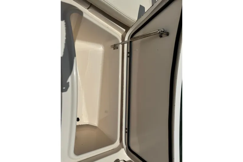 Slide: The Image of Open storage compartment on 2021 Grady-White 251 Coastal Explorer boat. - 78