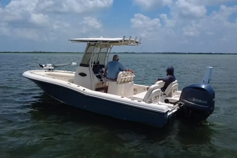 Slide: The Image of 2021 Grady-White 251 Coastal Explorer boat on water, featuring Yamaha outboard motor. - 29