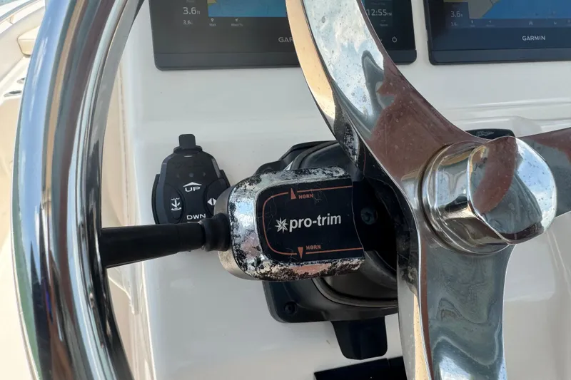 Slide: The Image of Steering wheel and controls of 2021 Grady-White 251 Coastal Explorer boat. - 87