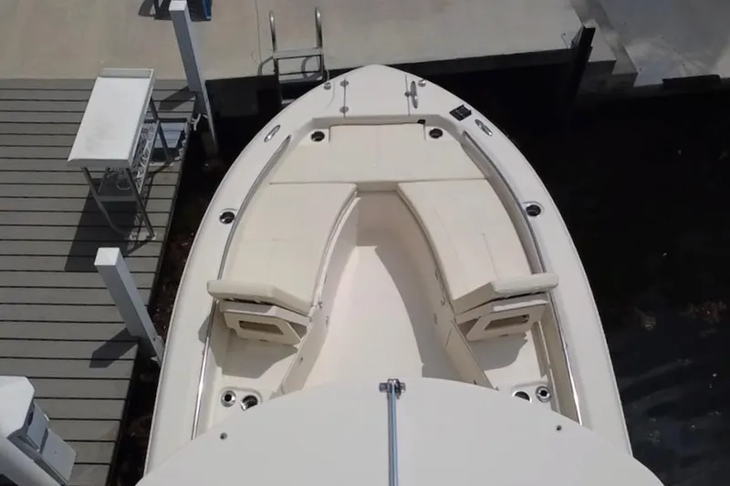 Slide: The Image of 2021 Grady-White 251 Coastal Explorer boat docked, featuring spacious bow seating. - 15
