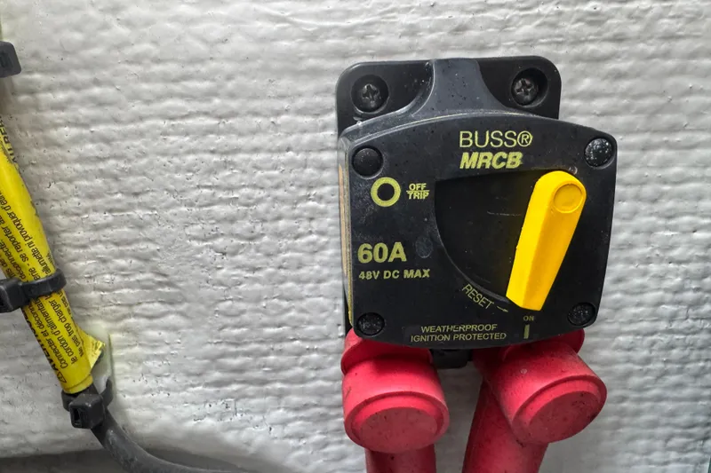 Slide: The Image of Weatherproof 60A circuit breaker on 2021 Grady-White 251 Coastal Explorer boat. - 89