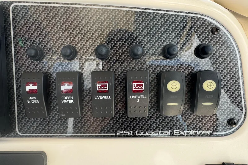 Slide: The Image of Control panel of 2021 Grady-White 251 Coastal Explorer boat with water and livewell switches. - 62