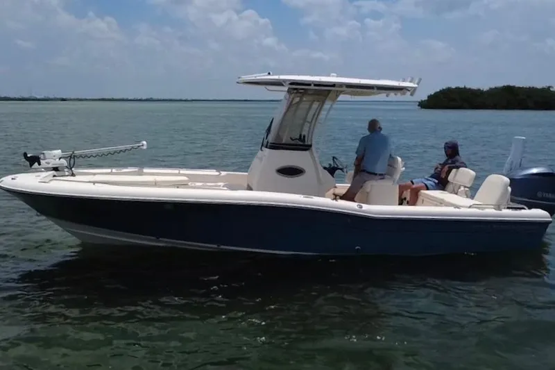Slide: The Image of 2021 Grady-White 251 Coastal Explorer boat on calm water, featuring a sleek design. - 31