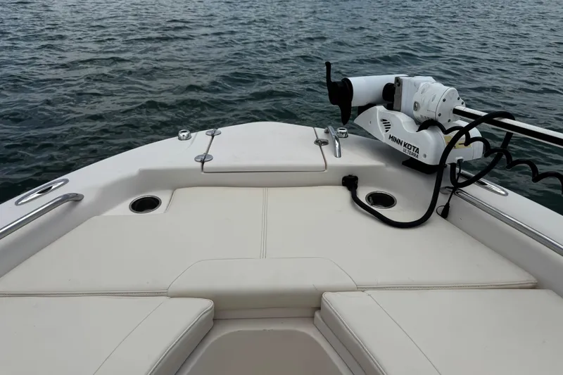 Slide: The Image of 2021 Grady-White 251 Coastal Explorer boat with Minn Kota Ulterra motor on calm water. - 74