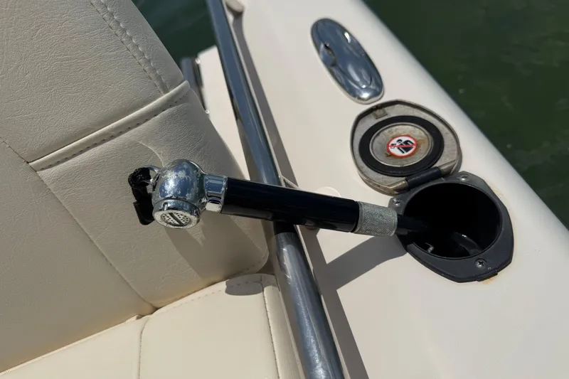 Slide: The Image of 2021 Grady-White 251 Coastal Explorer boat interior detail with rod holder and seat. - 81