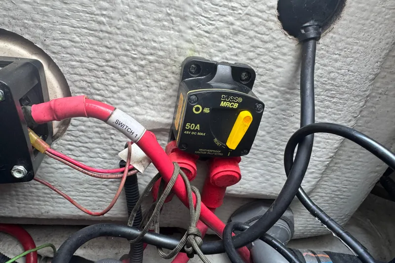 Slide: The Image of Electrical wiring and circuit breaker on a 2021 Grady-White 251 Coastal Explorer boat. - 92