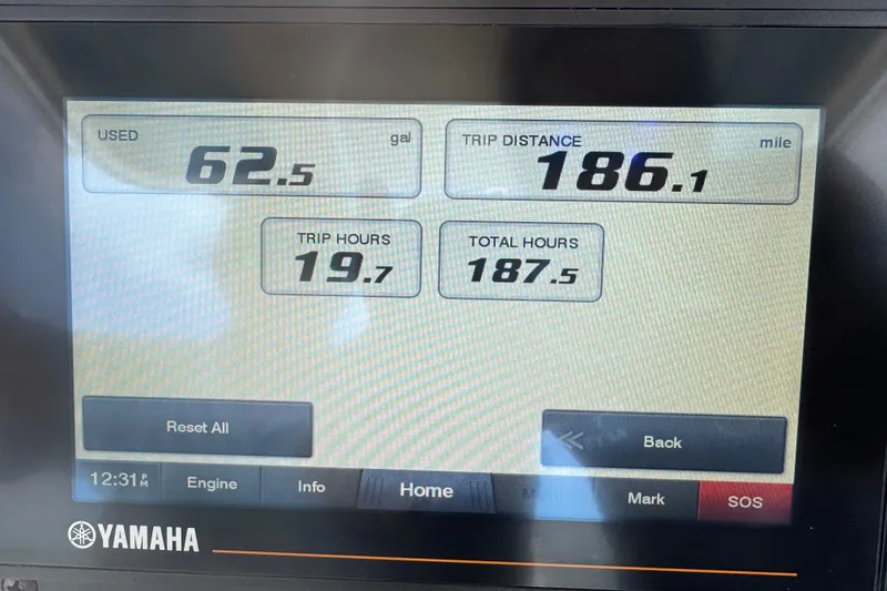 Slide: The Image of Yamaha display showing fuel usage, trip distance, and hours for 2021 Grady-White 251 Coastal Explorer. - 63