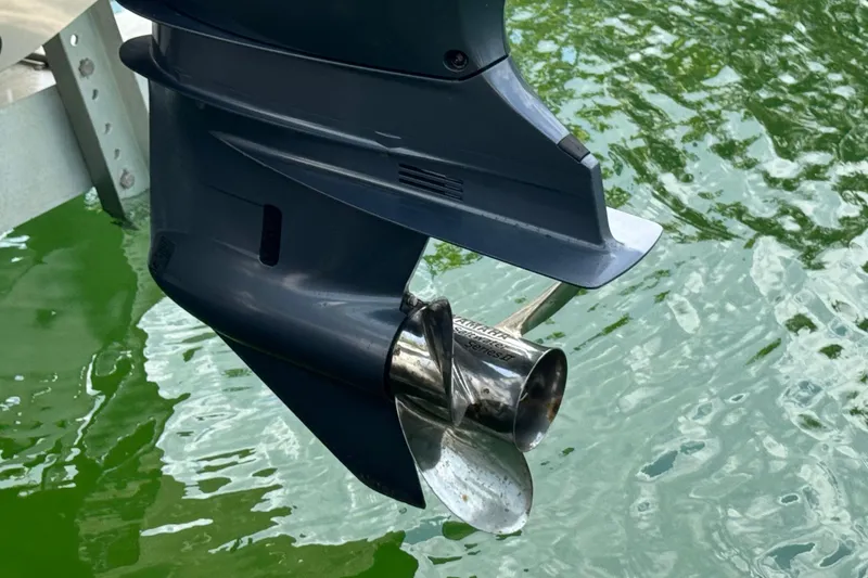 Slide: The Image of Outboard motor propeller of 2021 Grady-White 251 Coastal Explorer on water. - 42