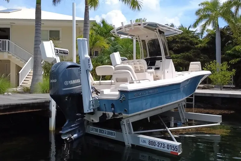 Slide: The Image of 2021 Grady-White 251 Coastal Explorer boat docked with Yamaha engine. - 19