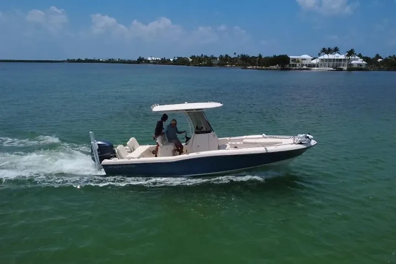 Slide: The Image of 2021 Grady-White 251 Coastal Explorer cruising on clear blue waters. - 39