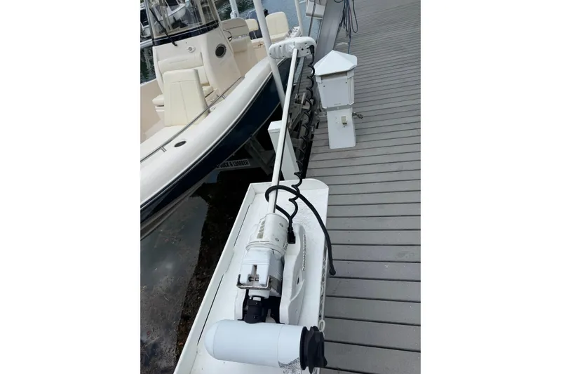 Slide: The Image of 2021 Grady-White 251 Coastal Explorer boat docked with trolling motor. - 44