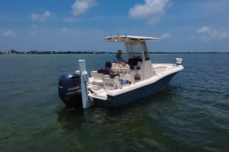 Slide: The Image of 2021 Grady-White 251 Coastal Explorer boat on calm water, featuring Yamaha outboard motor. - 27