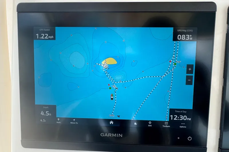 Slide: The Image of Garmin navigation display on 2021 Grady-White 251 Coastal Explorer, showing speed and depth. - 61