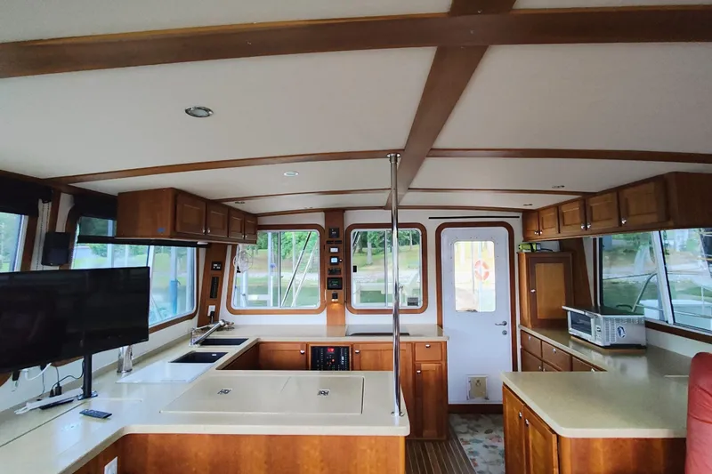 Slide: The Image of Interior of a yacht with wooden furnishings and modern amenities. - 28