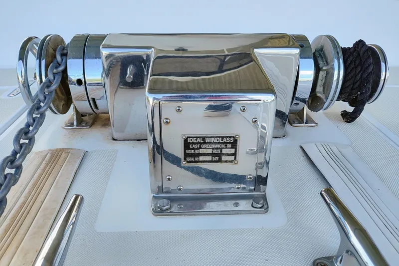 Slide: The Image of Close-up of a shiny windlass with chains and ropes on a boat. - 13